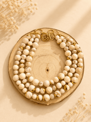 Collar triple de perlas